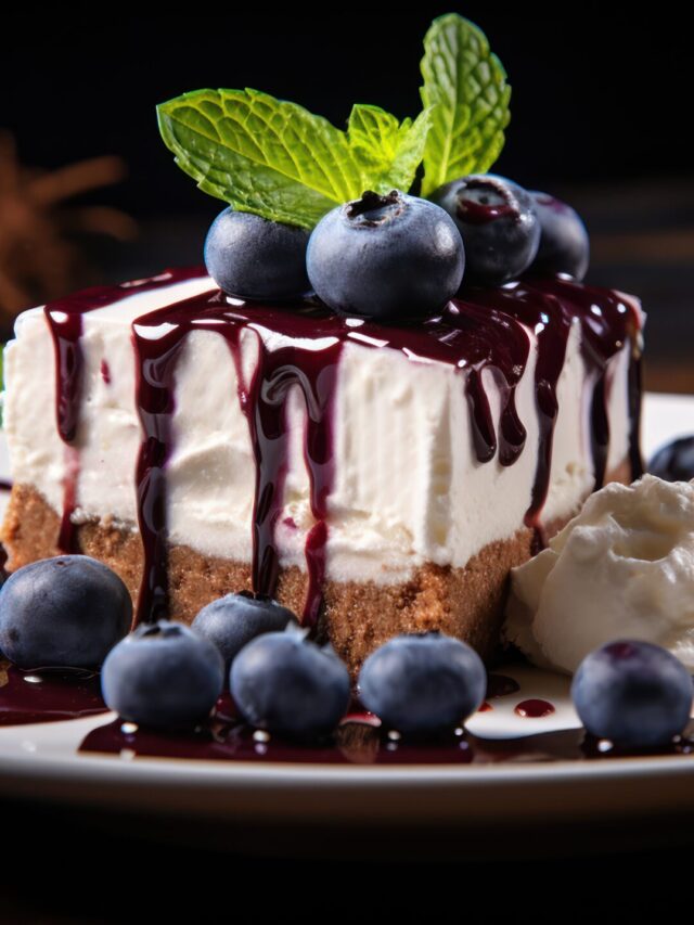 Plate of chocolate cheesecake and white cake garnished with blue